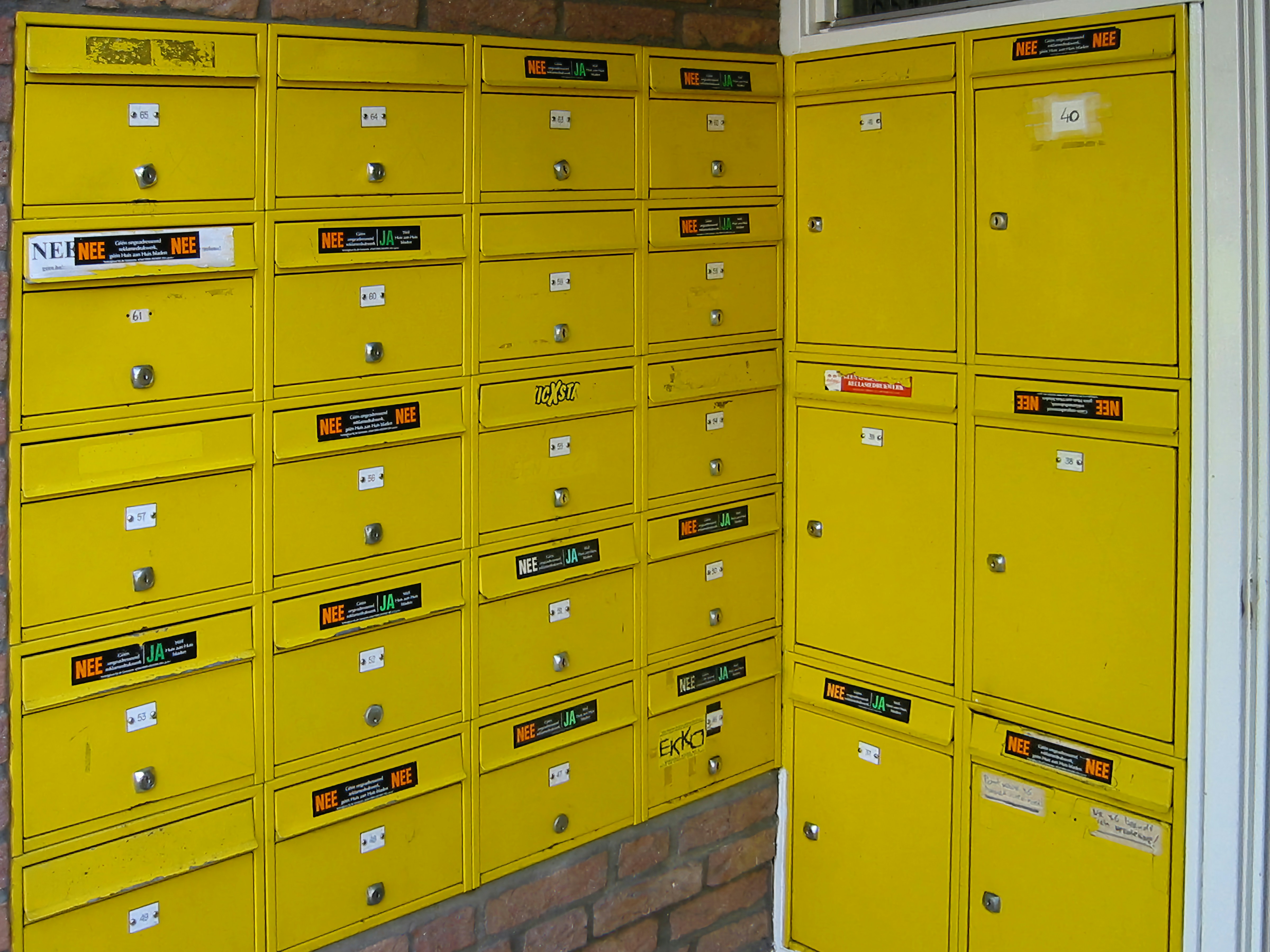 Stackable storage bins with soft-touch lids